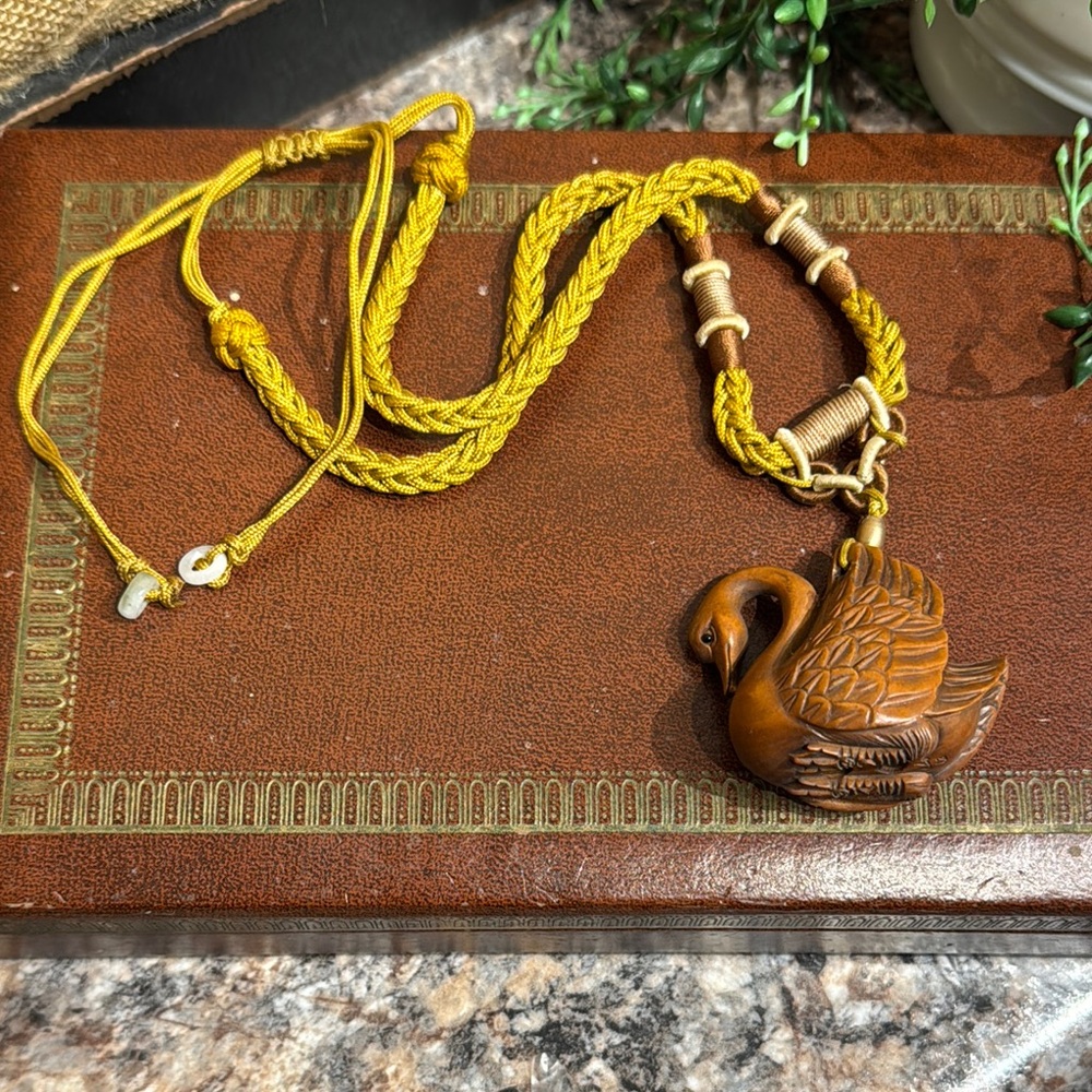 Vintage adjustable necklace with carved goose pendant